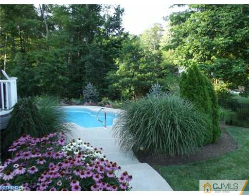1 Cutter Court Cream Ridge, NJ 08514 - Photo 3 of 25 a view of a garden with flowers and trees