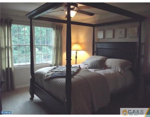1 Cutter Court Cream Ridge, NJ 08514 - Photo 22 of 25 a bed sitting in a bedroom next to a window