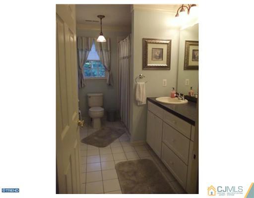 1 Cutter Court Cream Ridge, NJ 08514 - Photo 24 of 25 a bathroom with a sink a toilet and mirror