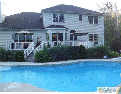 1 Cutter Court Cream Ridge, NJ 08514 - Photo 4 of 25 a front view of a house with a yard