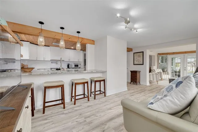 a kitchen with stainless steel appliances granite countertop a sink and cabinets