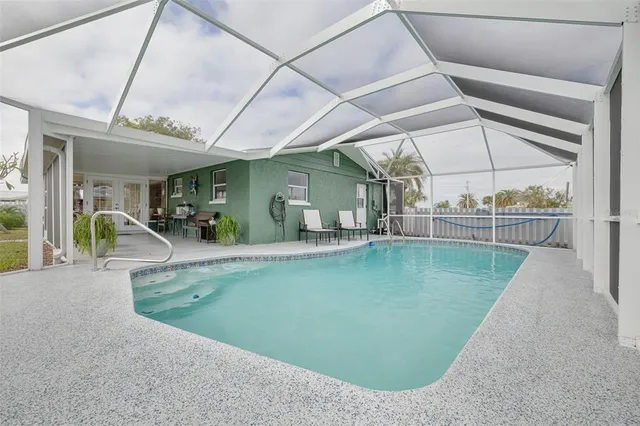 a view of a living room and floor to ceiling window