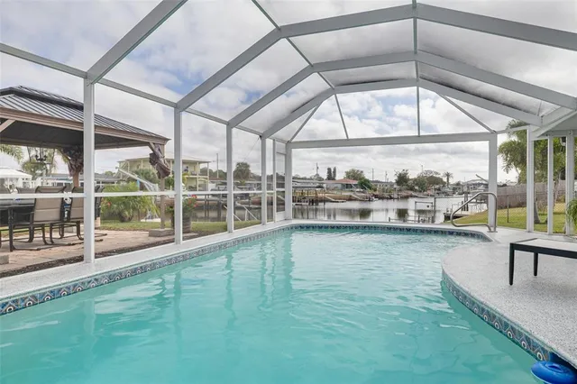 a view of a chairs and table in the patio
