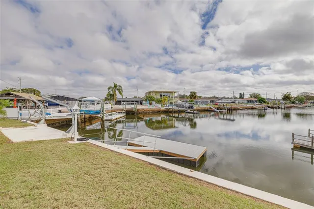 a swimming pool view with a outdoor seating space