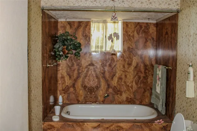 a view of a livingroom with furniture and a fireplace