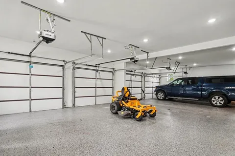 a view of a garage with cars