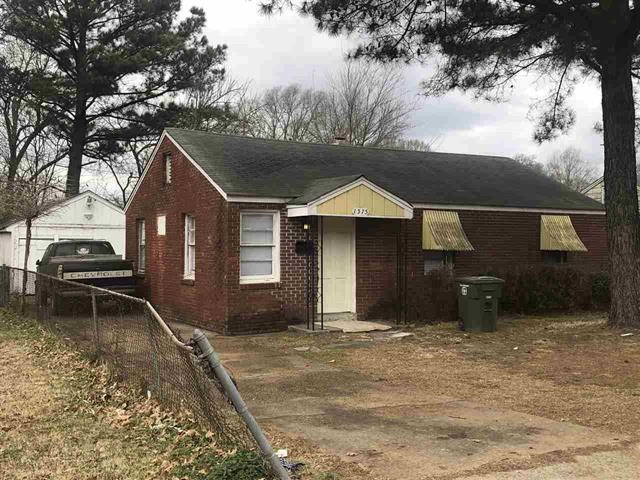 1375 Wells Station Road Memphis, TN 38108 - Photo 1 of 1 a front view of a house with a yard