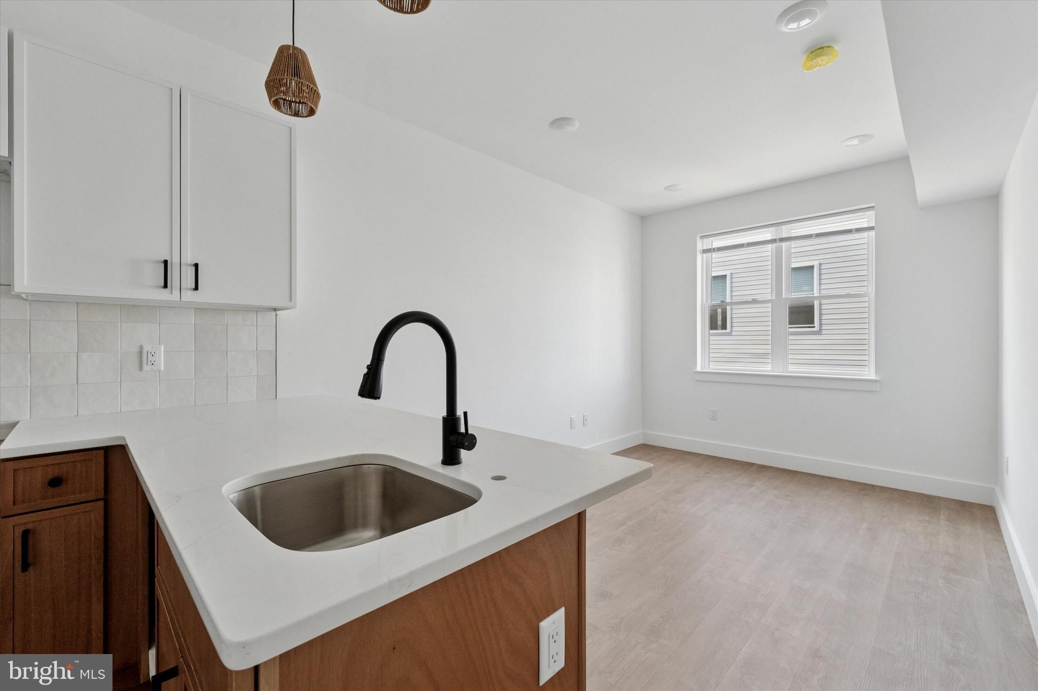 2520 North Front Street, Unit 403 Philadelphia, PA 19133 - Photo 1 of 8 a kitchen with a sink and a stove