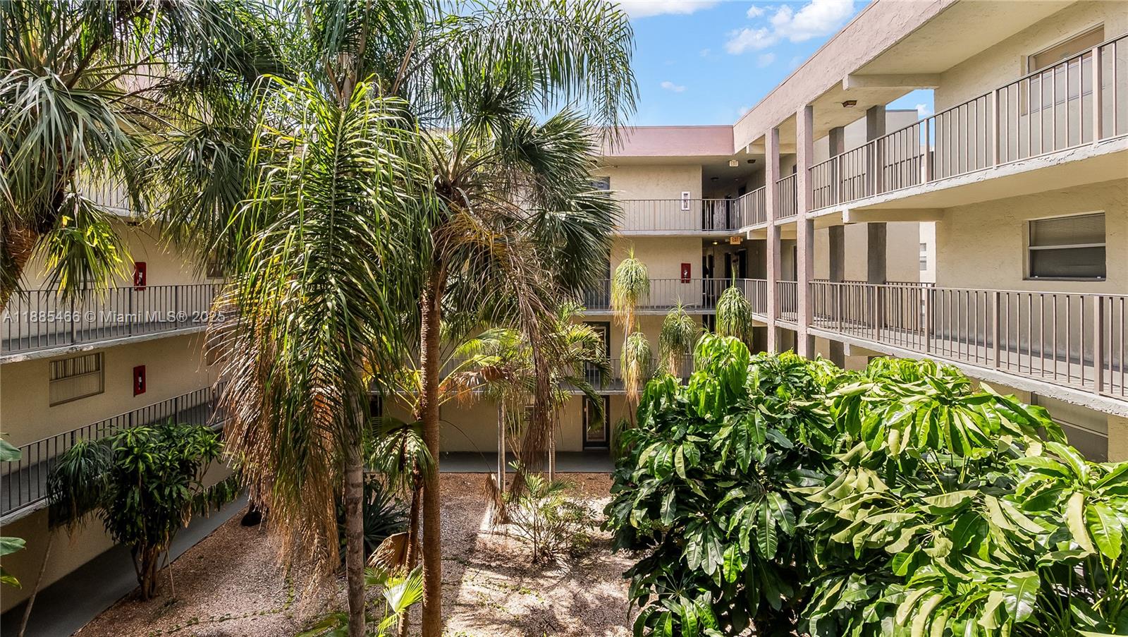 1820 Southwest 81st Avenue, Unit 3306 North Lauderdale, FL 33068 - Photo 1 of 15 a front view of a multi story residential apartment building with a yard