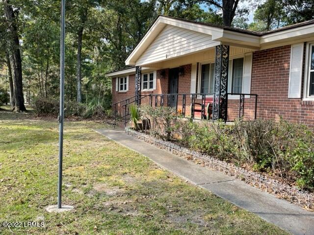 1 State Rd S-7-428 Beaufort, SC 29907 - Photo 3 of 43 front porch with flagpole