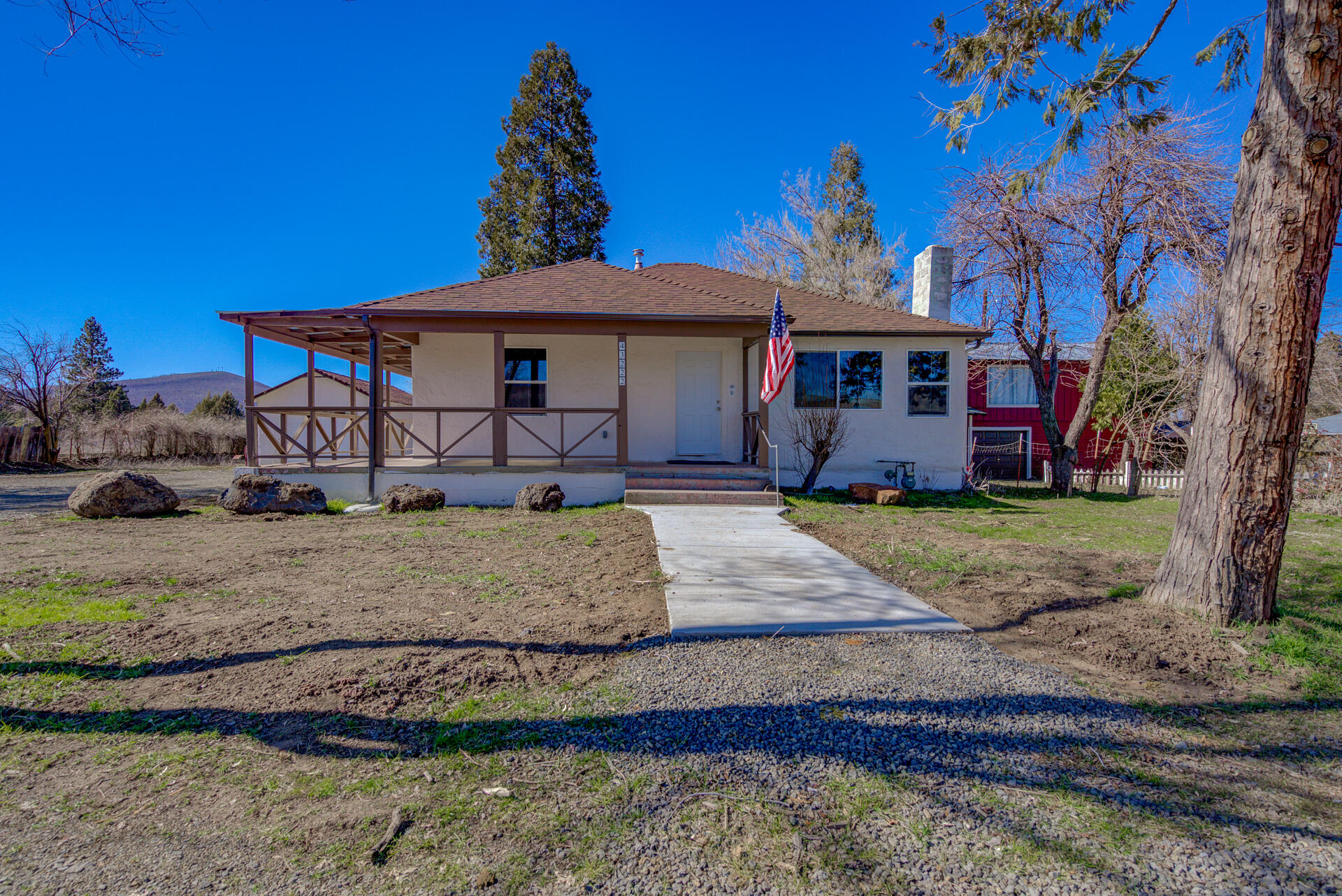 43222 State Highway Fall River Mills, CA 96028 - Photo 5 of 38 a front view of a house with garden