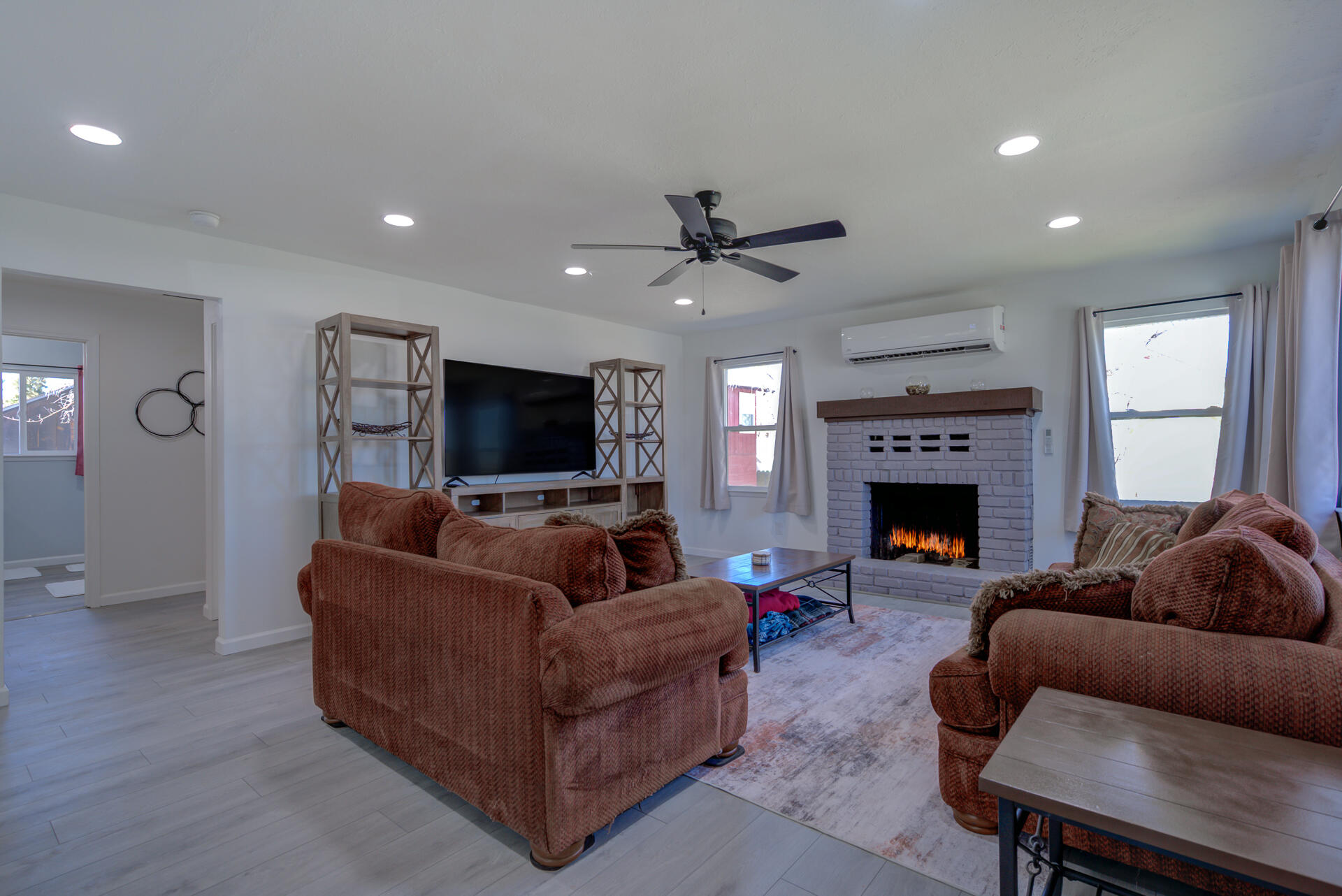 43222 State Highway Fall River Mills, CA 96028 - Photo 8 of 38 a living room with furniture a flat screen tv and a fireplace