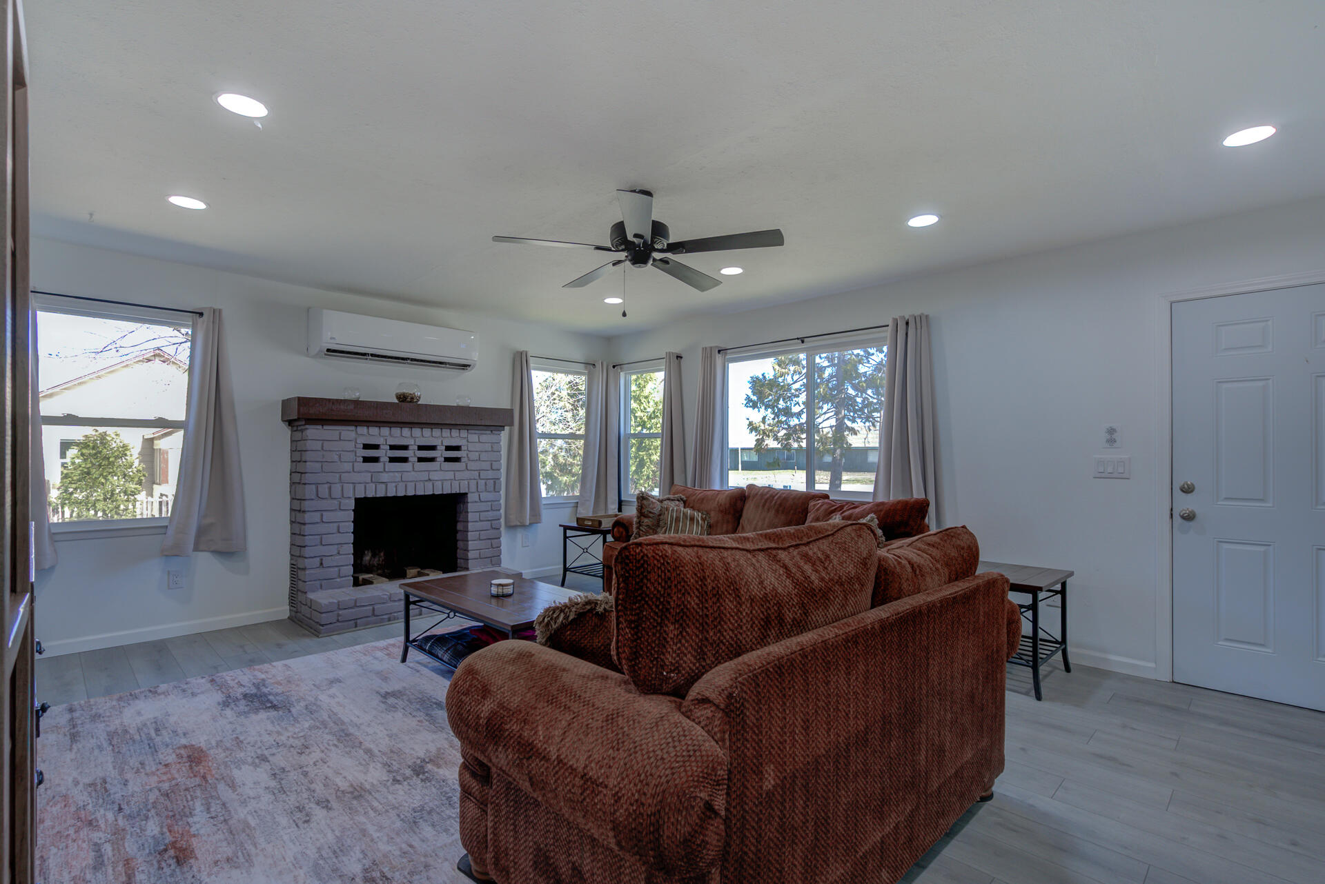 43222 State Highway Fall River Mills, CA 96028 - Photo 9 of 38 a living room with furniture a window and a fireplace