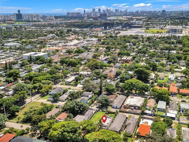 an aerial view of residential building and lake