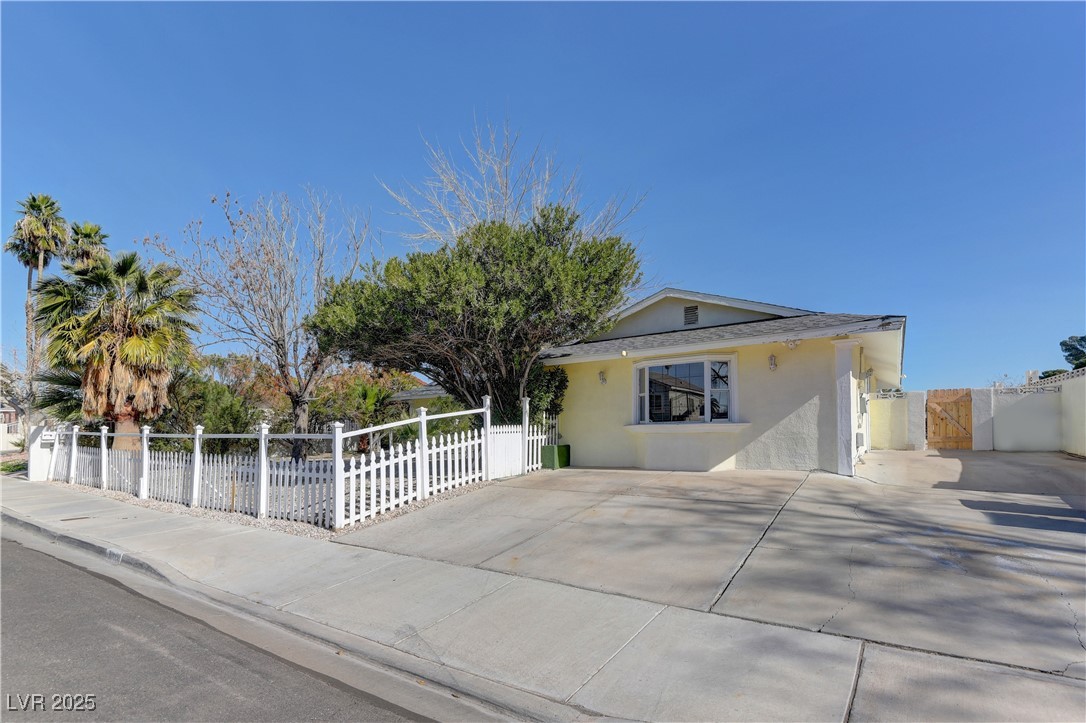 5248 Rambling Road Las Vegas, NV 89120 - Photo 2 of 35 View of front of property with a gate and stucco siding
