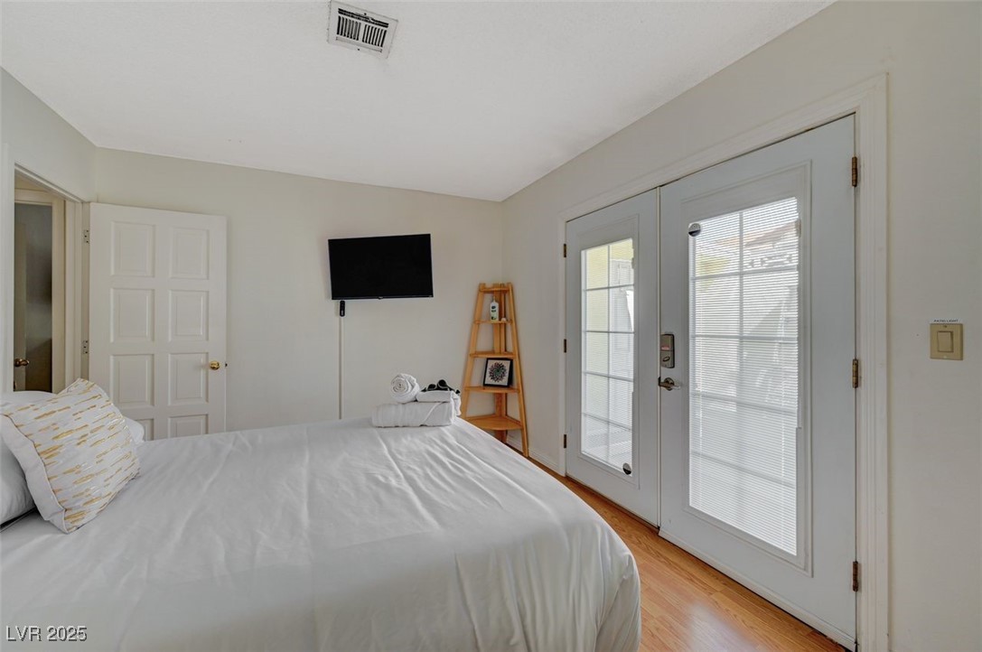 5248 Rambling Road Las Vegas, NV 89120 - Photo 2 of 33 Bedroom featuring access to exterior, french doors, and light wood finished floors