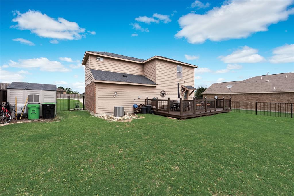 149 Cattlemans Creek Road Newark, TX 76071 - Photo 26 of 39 Large backyard with oversized deck and storage shed at 149 Cattlemans Creek Rd in the Chisholm Springs neighborhood in Newark, TX 76071