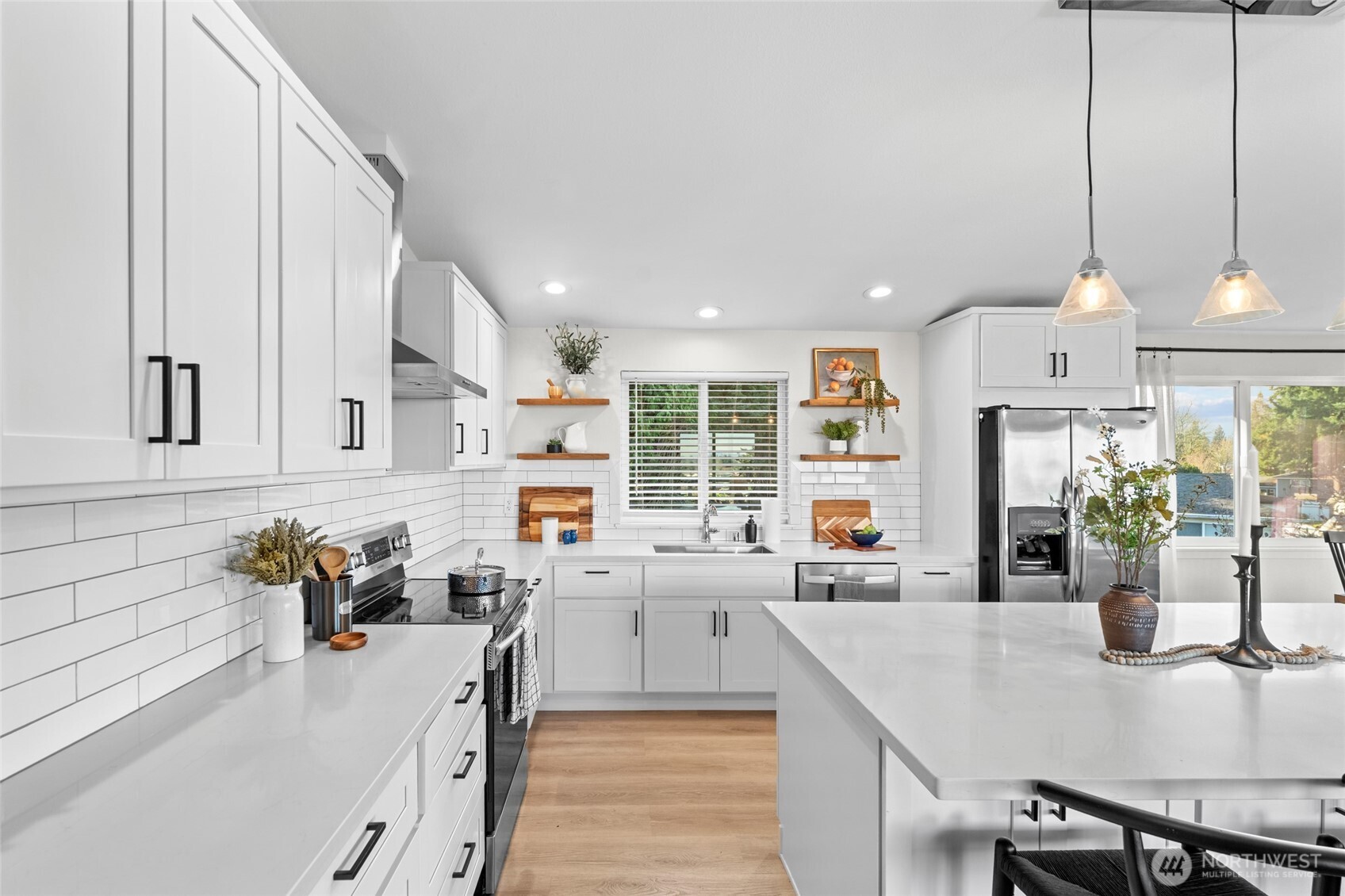 30013 2nd Avenue Southwest Federal Way, WA 98023 - Photo 12 of 40 a kitchen view with stainless steel appliances granite countertop a stove and more cabinets