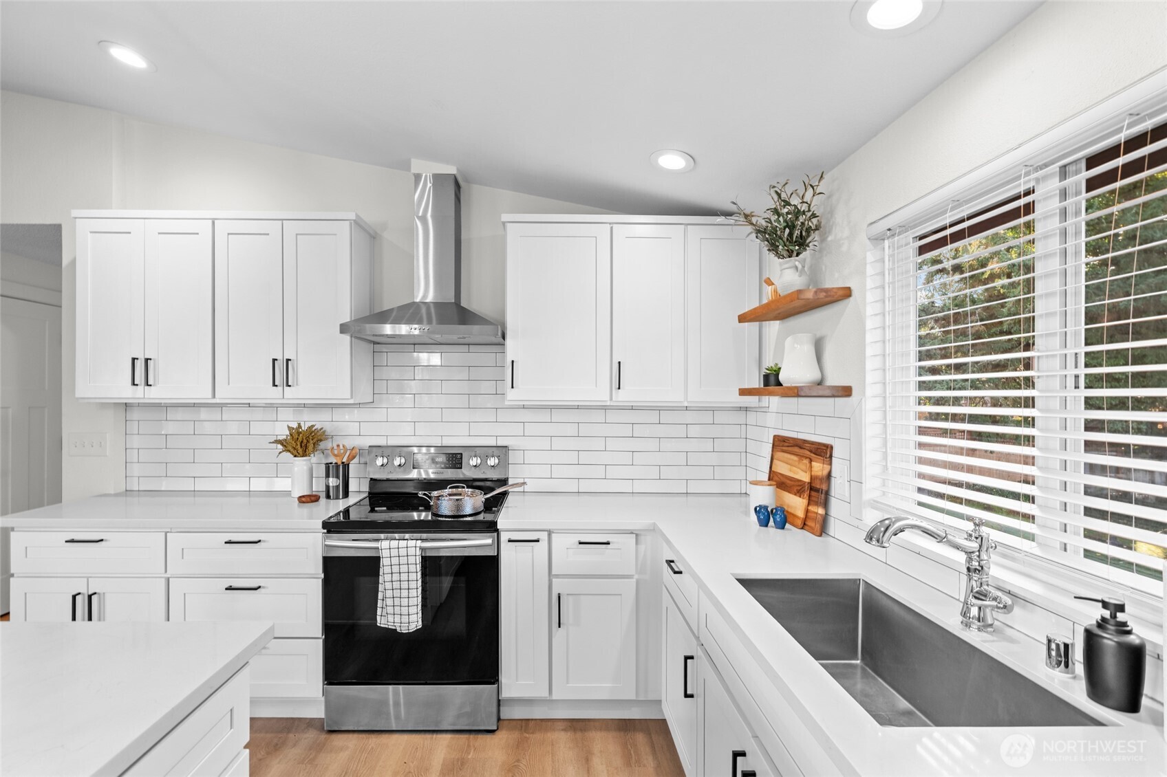 30013 2nd Avenue Southwest Federal Way, WA 98023 - Photo 14 of 40 a kitchen with granite countertop a stove sink and cabinets