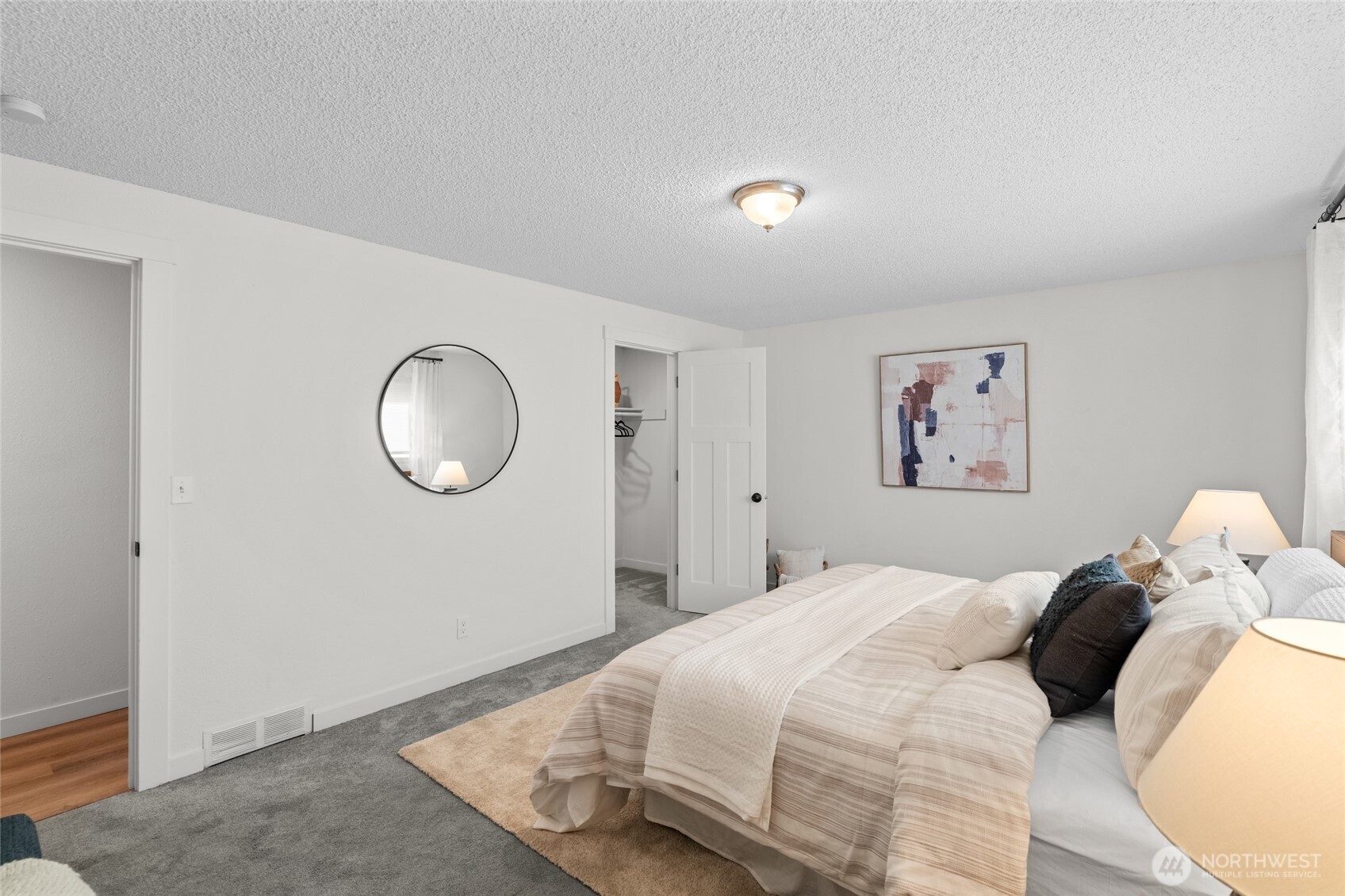 30013 2nd Avenue Southwest Federal Way, WA 98023 - Photo 19 of 40 a bedroom with a bed and a painting on the wall