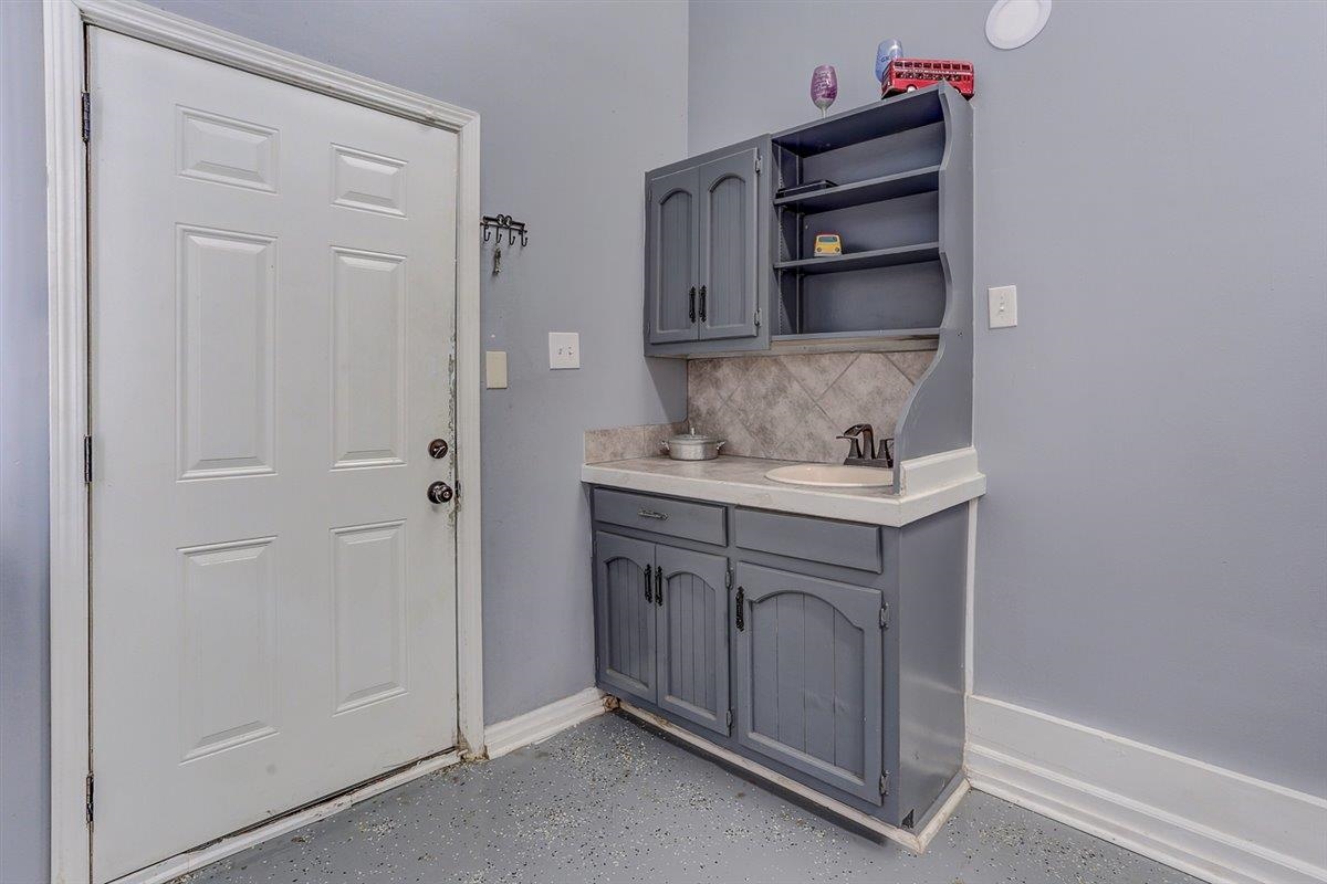 3700 Lakeview Road Memphis, TN 38116 - Photo 17 of 40 Laundry room featuring baseboards and a sink
