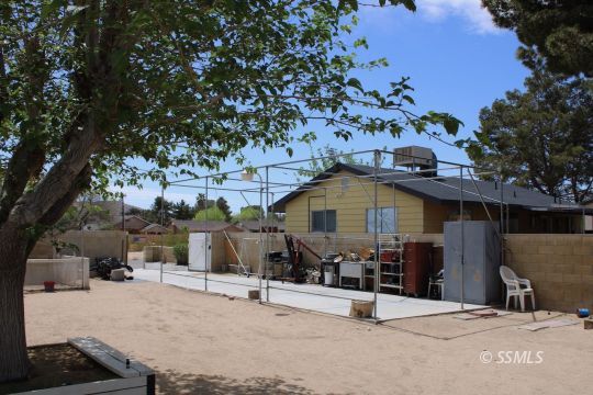 1043 South Downs Street Ridgecrest, CA 93555 - Photo 10 of 13 a view of a street with wooden fence
