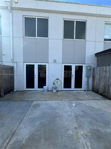 a front view of the house with a yard and garage