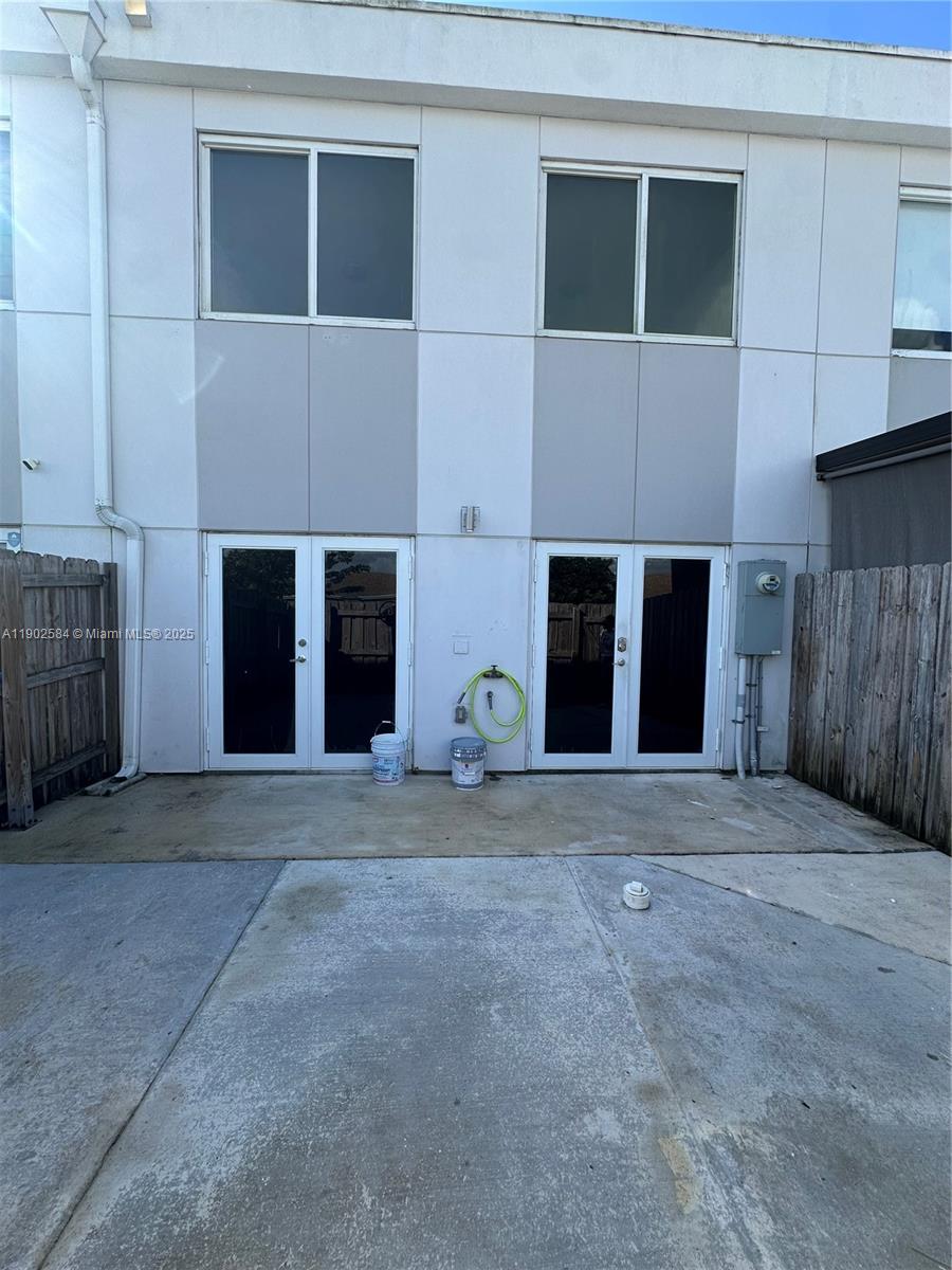 13712 Southwest 259th Street Homestead, FL 33032 - Photo 2 of 8 a front view of the house with a yard and garage