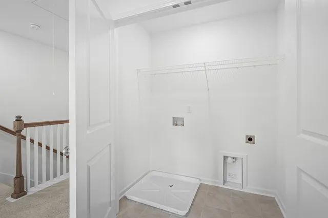 a front view of a building with a garden