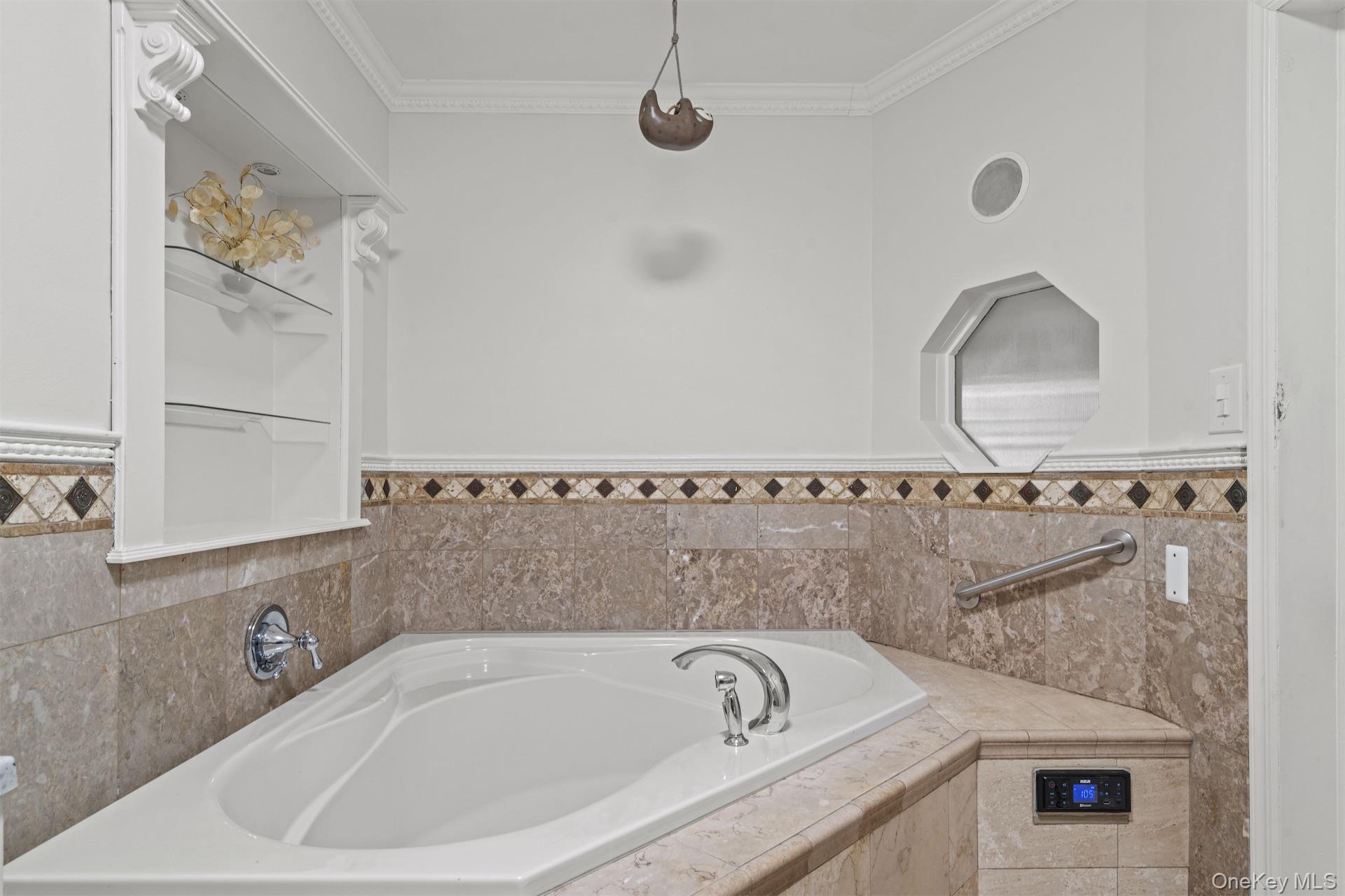 44-46 Decatur Street Brooklyn, NY 11216 - Photo 11 of 50 Full bathroom featuring a garden tub and ornamental molding