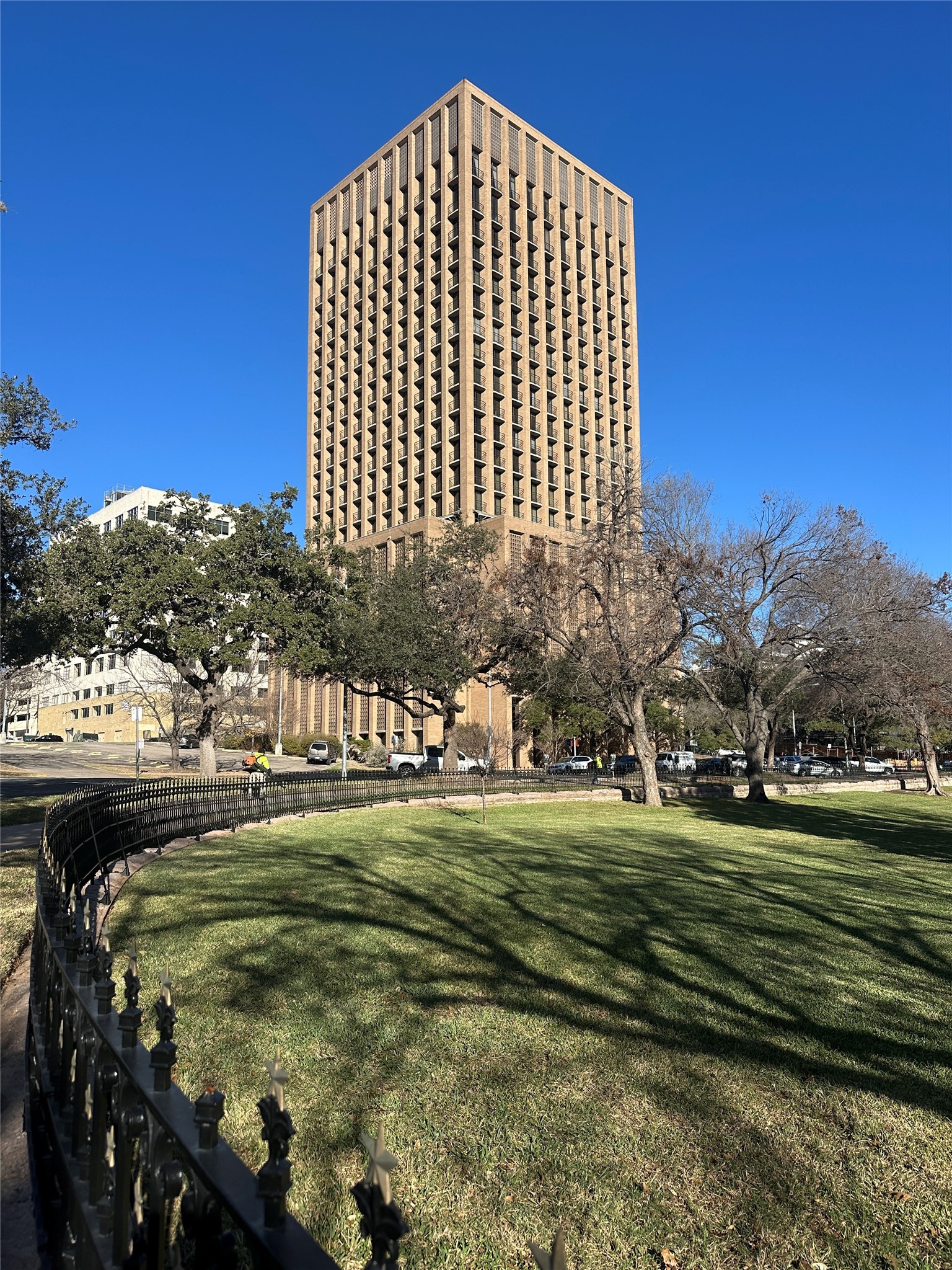 1122 Colorado Street, Unit 1609 Austin, TX 78701 - Photo 1 of 29 a view of a big building with a big yard and large trees