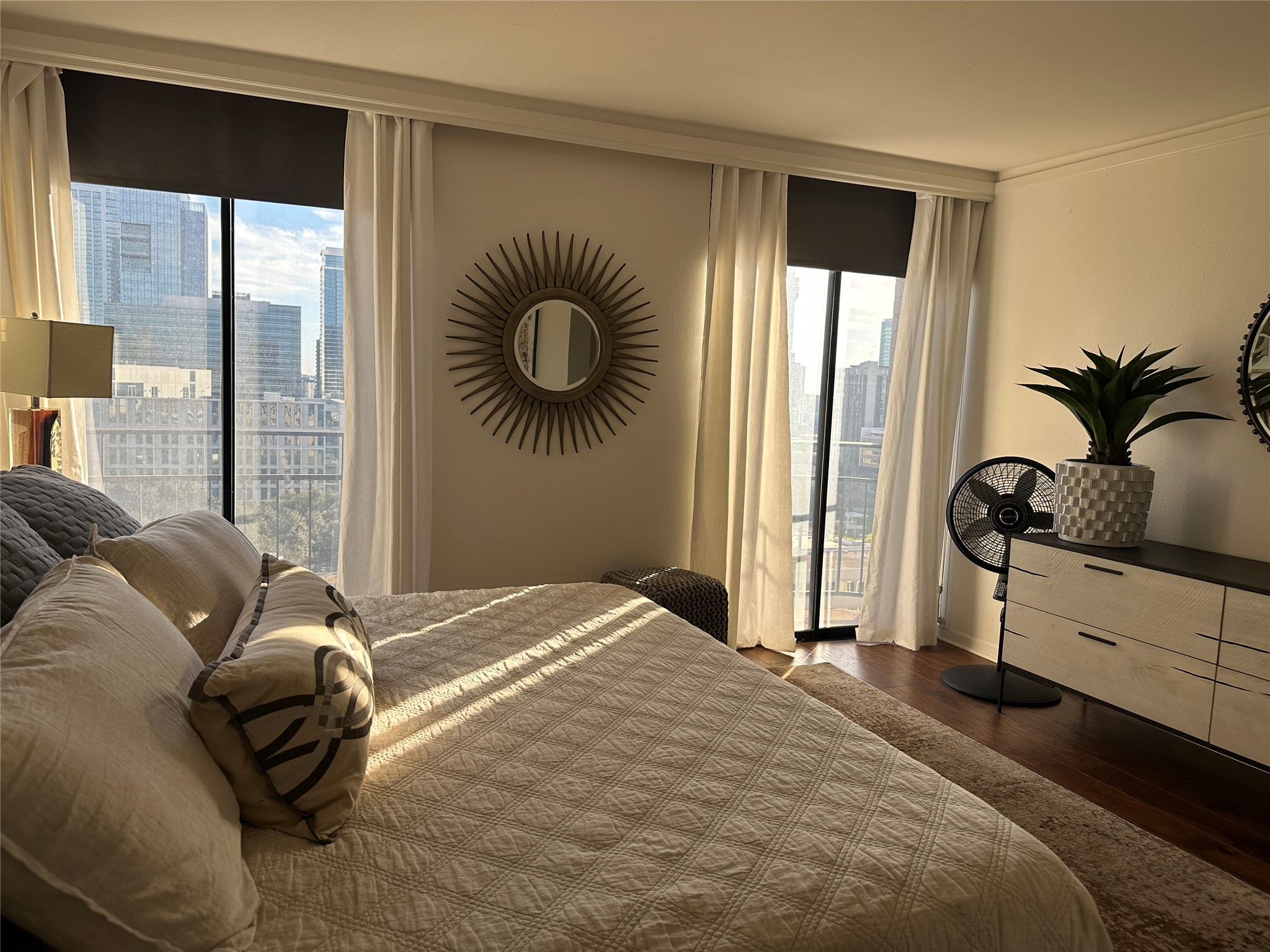 1122 Colorado Street, Unit 1609 Austin, TX 78701 - Photo 11 of 29 a bedroom with a bed and a large window