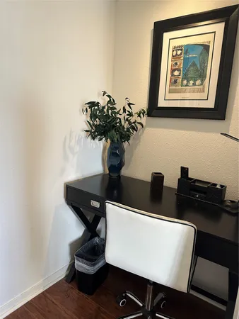 a view of a workspace with furniture