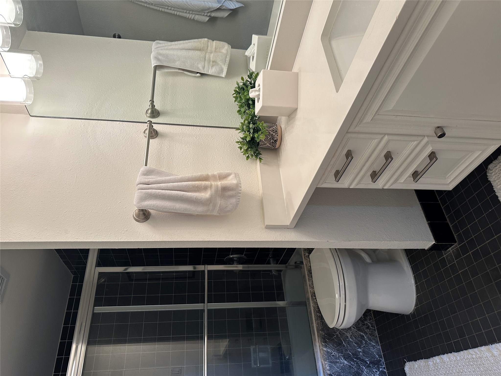 1122 Colorado Street, Unit 1609 Austin, TX 78701 - Photo 15 of 29 a bathroom with a sink a toilet and shower