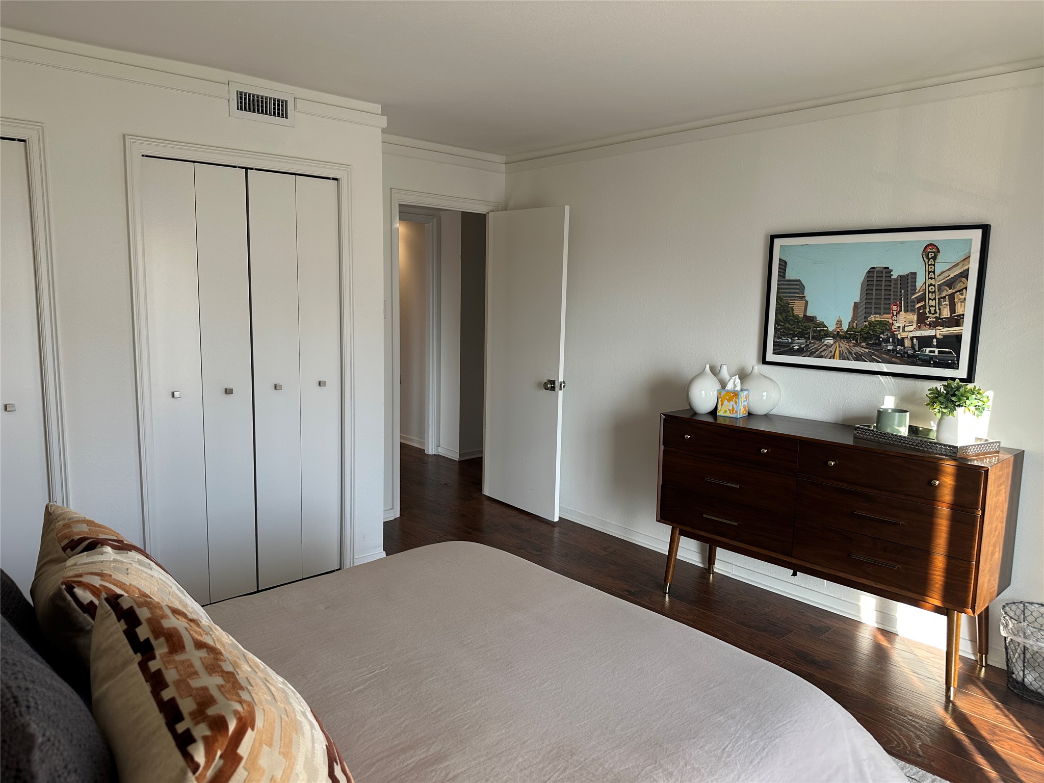 1122 Colorado Street, Unit 1609 Austin, TX 78701 - Photo 20 of 29 a bedroom with a bed and a painting on the wall