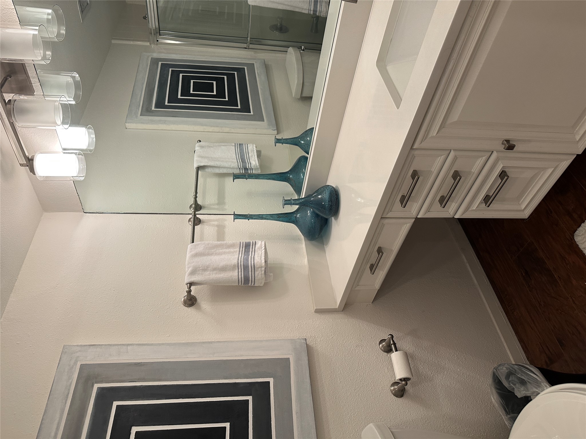 1122 Colorado Street, Unit 1609 Austin, TX 78701 - Photo 22 of 29 a bathroom with a sink and a mirror