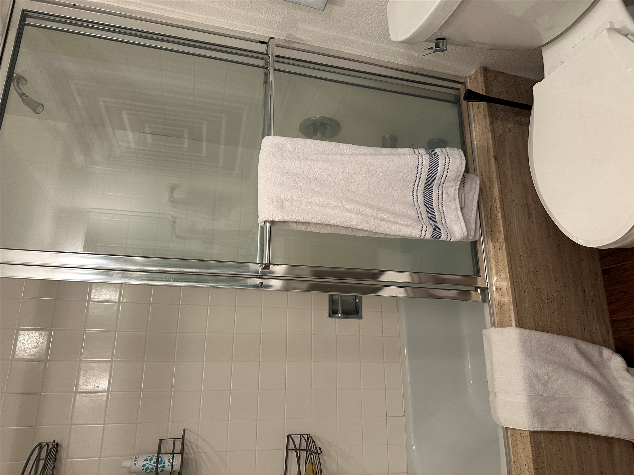 1122 Colorado Street, Unit 1609 Austin, TX 78701 - Photo 23 of 29 a bathroom with a toilet and a shower