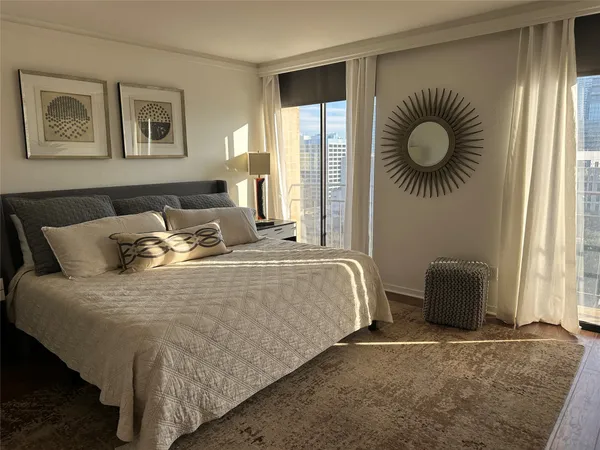 a bedroom with a bed and window