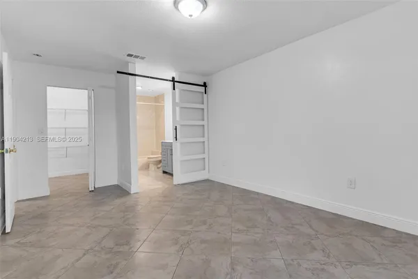 an empty room with closet area