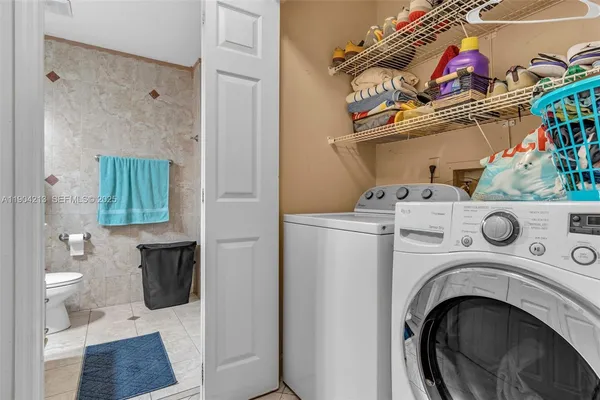 a utility room with dryer and washer