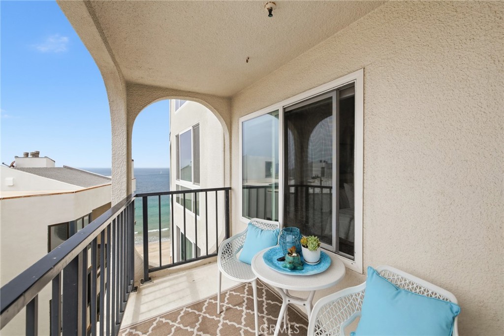 565 Esplanade, Unit 312 Redondo Beach, CA 90277 - Photo 1 of 32 a view of a dining room with furniture window and wooden floor