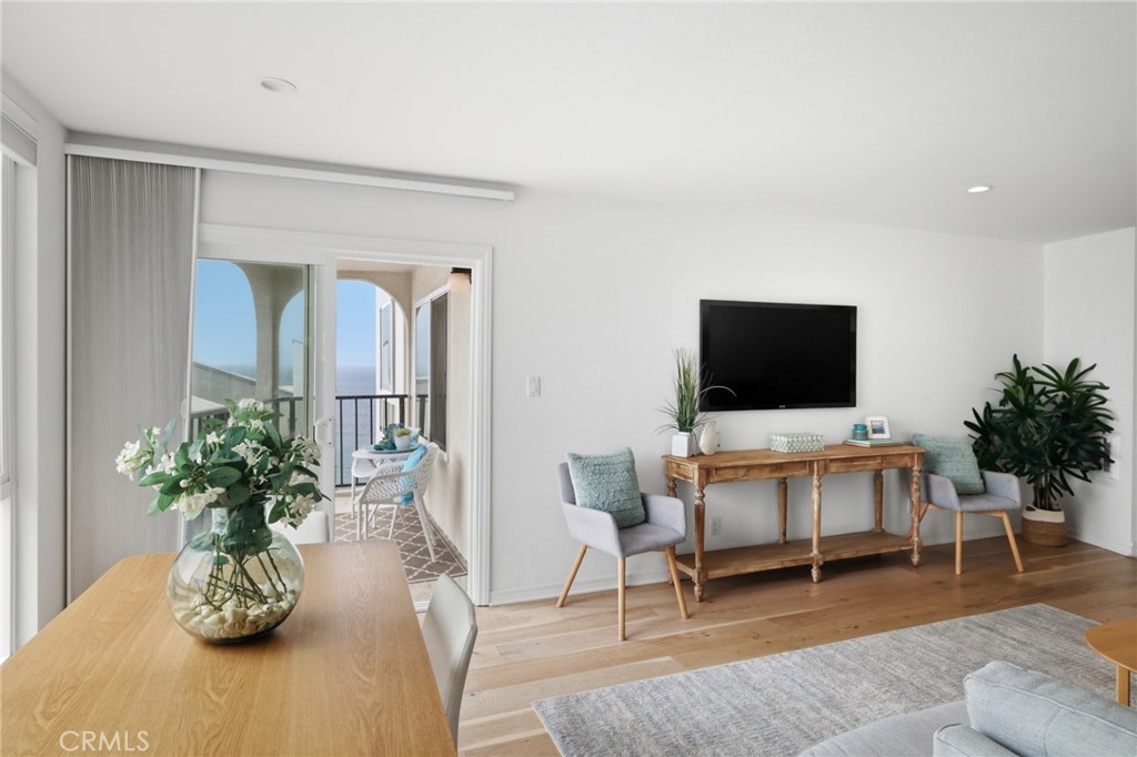 565 Esplanade, Unit 312 Redondo Beach, CA 90277 - Photo 10 of 32 a living room with furniture and a flat screen tv
