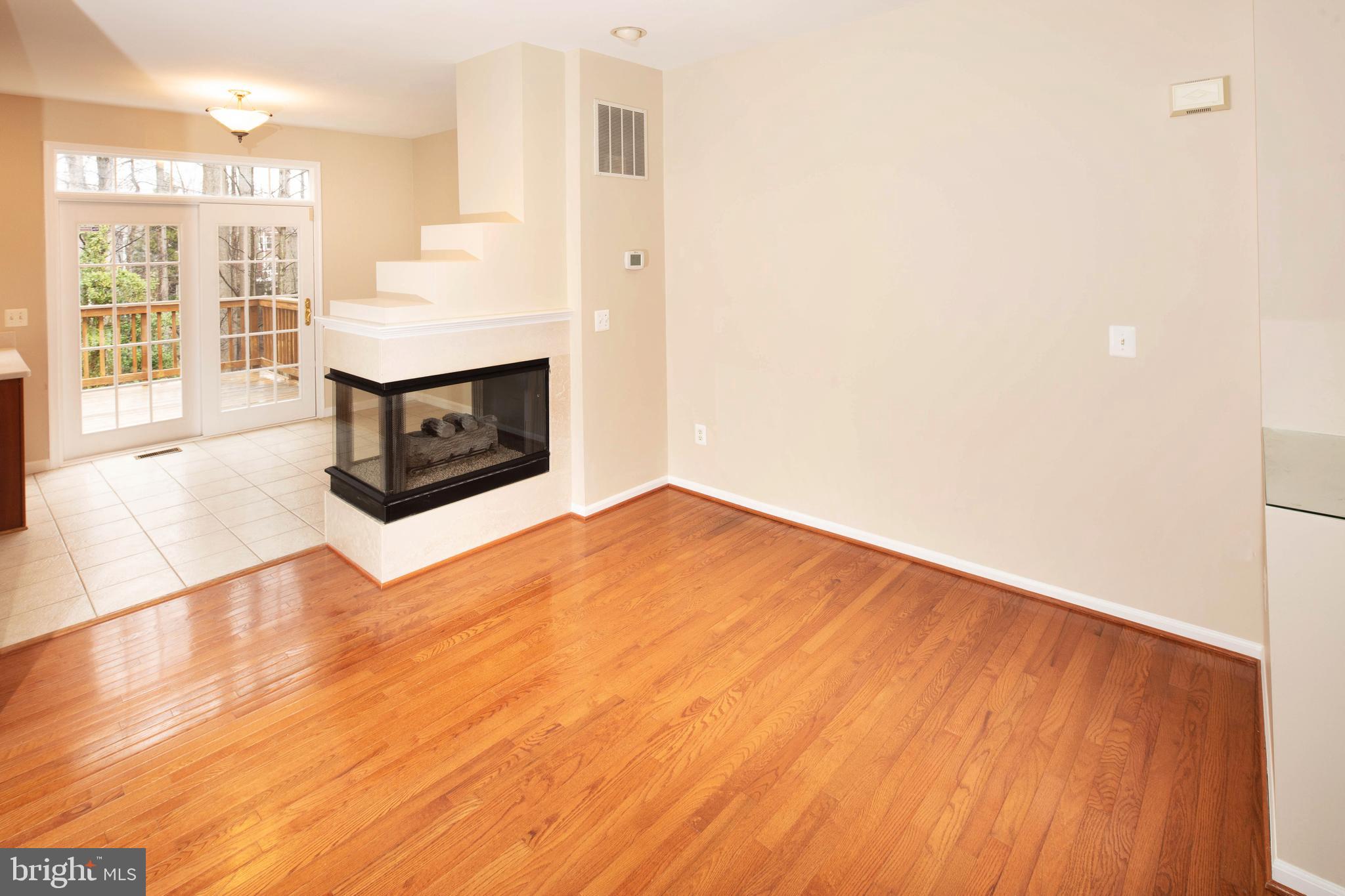 1265 Wild Hawthorn Way Reston, VA 20194 - Photo 14 of 56 Dining Room w/ 3 Sided Gas Fireplace