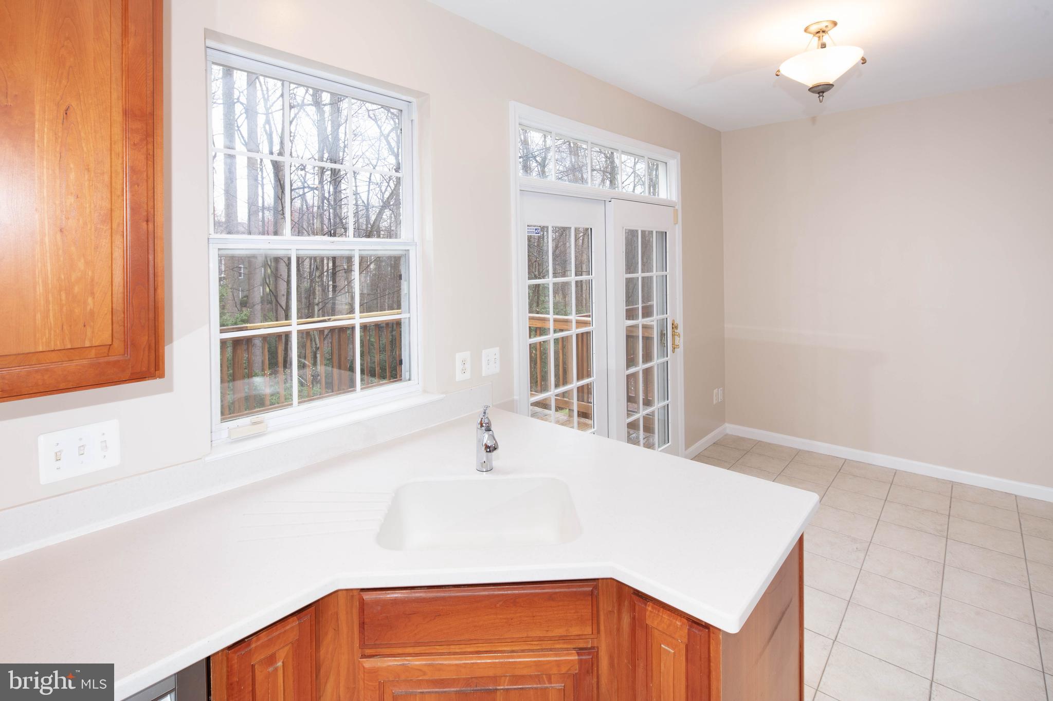 1265 Wild Hawthorn Way Reston, VA 20194 - Photo 20 of 56 Kitchen w/ S/S Appliance, Corian and Tile Flooring