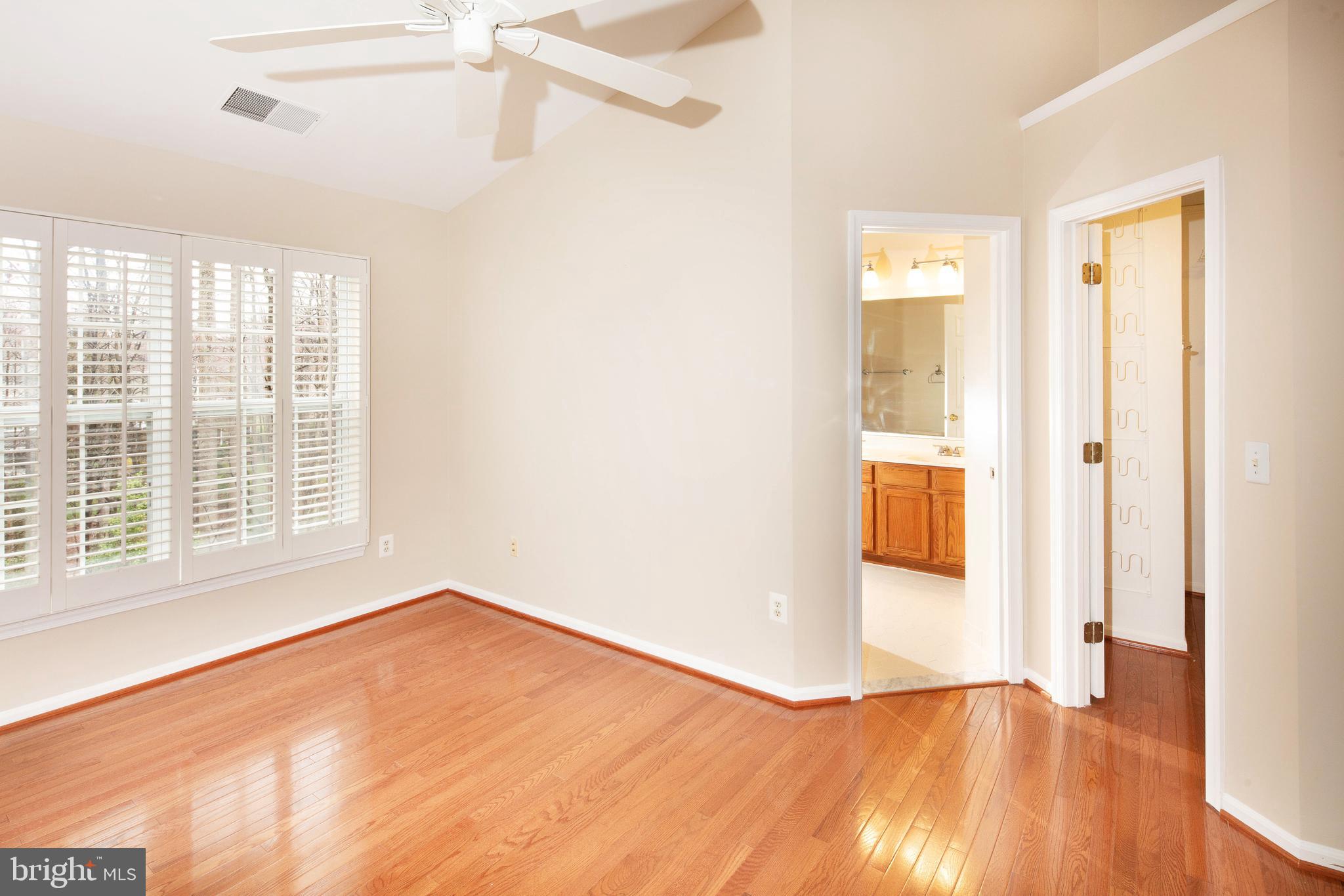 1265 Wild Hawthorn Way Reston, VA 20194 - Photo 30 of 56 Primary Bedroom w/ Wood Floor & Cathedral Ceiling