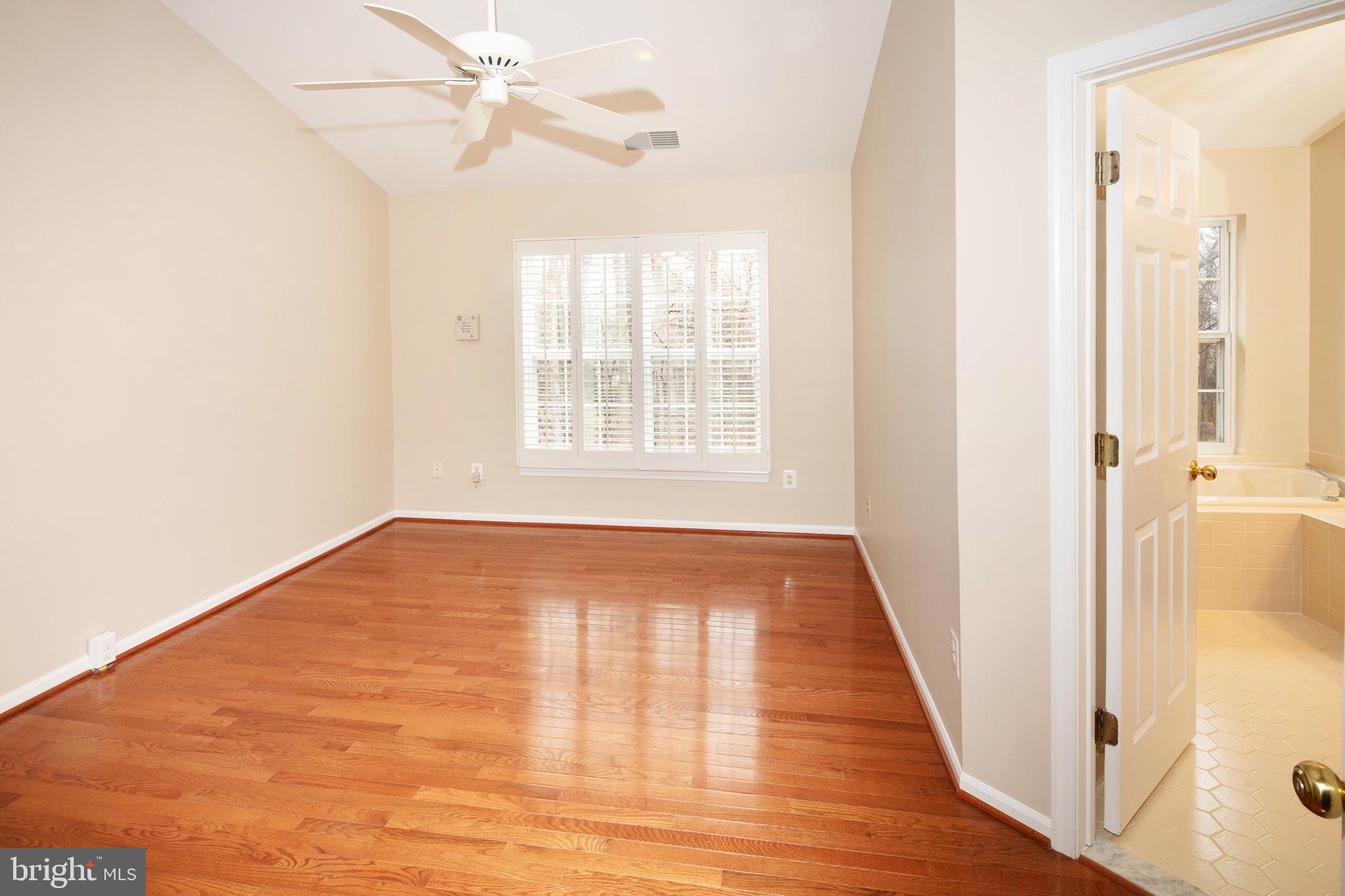 1265 Wild Hawthorn Way Reston, VA 20194 - Photo 31 of 56 Primary Bedroom w/ Wood Floor & Cathedral Ceiling