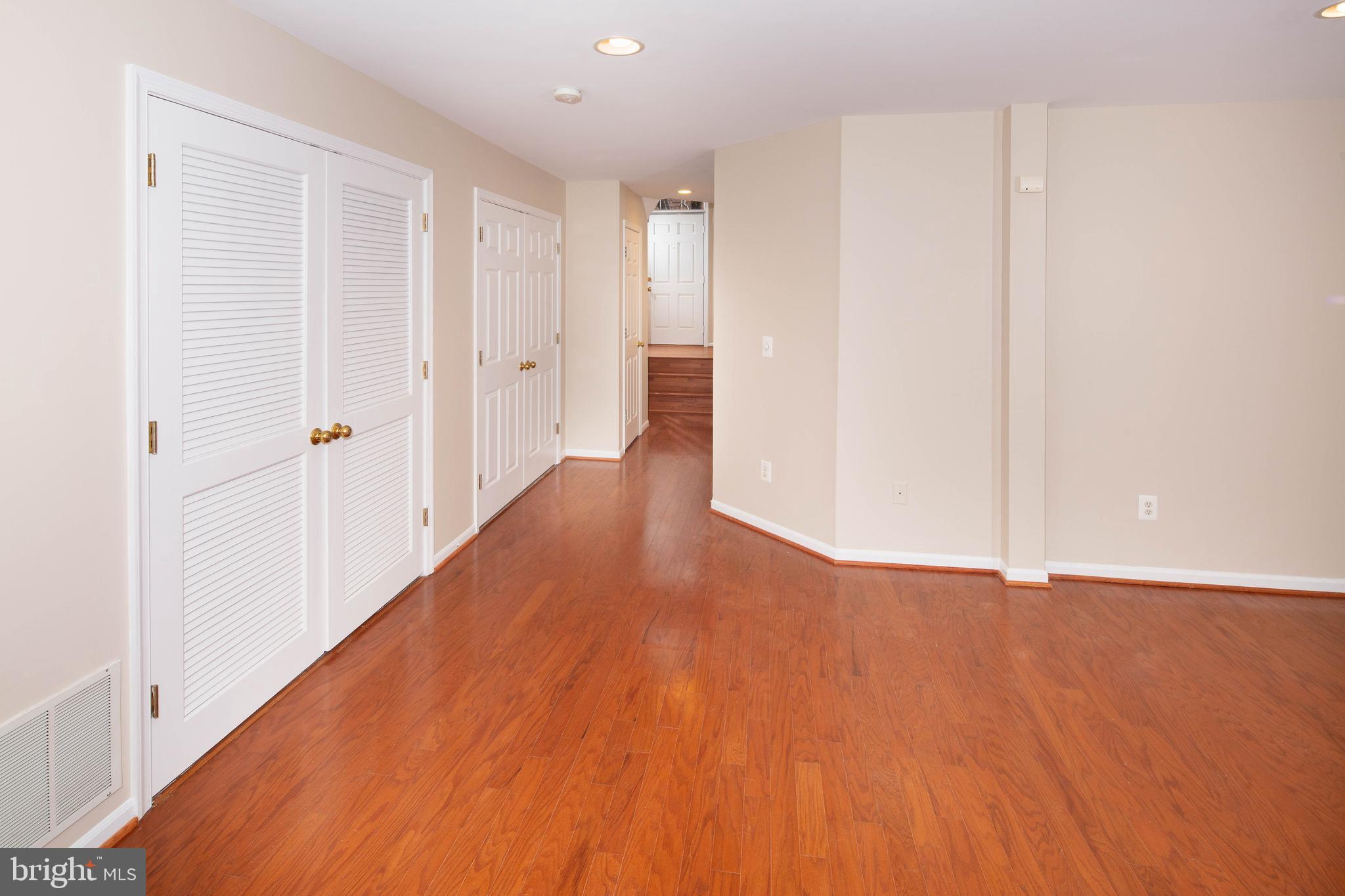 1265 Wild Hawthorn Way Reston, VA 20194 - Photo 47 of 56 Family Room w/ Engineered Wood Flooring