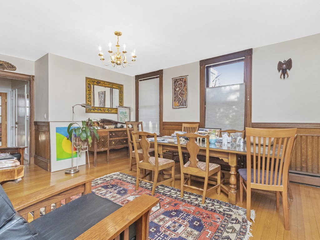 90 Addington Road, Unit 1 Brookline, MA 02445 - Photo 5 of 41 a living room with lots of furniture and a chandelier