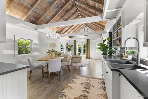 a dining room with a table and chairs