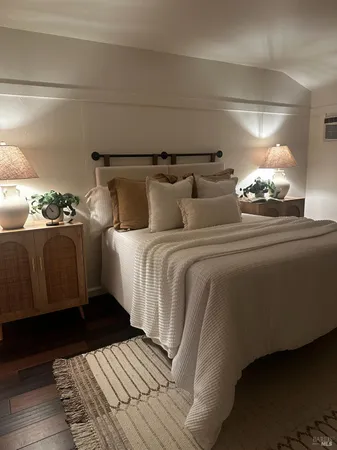 a bedroom with a bed and a couch